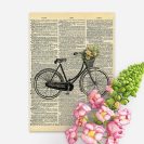 Plakat z rowerem i gazetą do upiększenia gabinetu